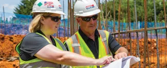 field staff reading over plans