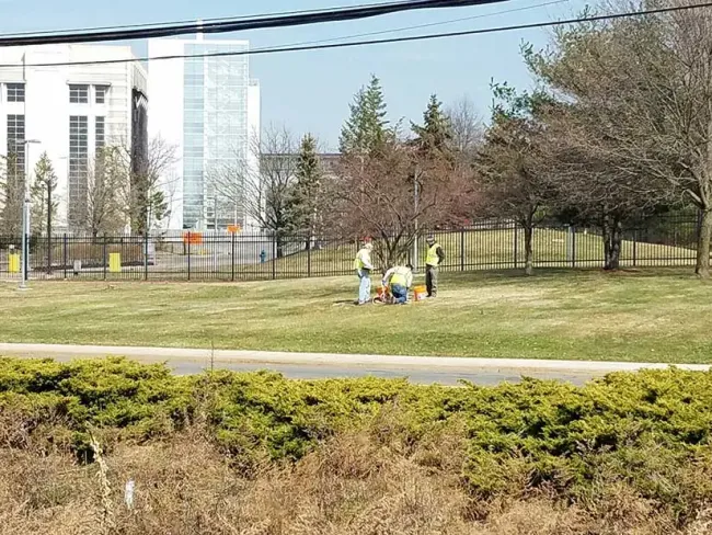 Workers testing the ground