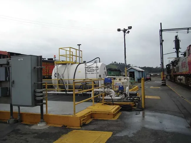 Used oil container in train yard